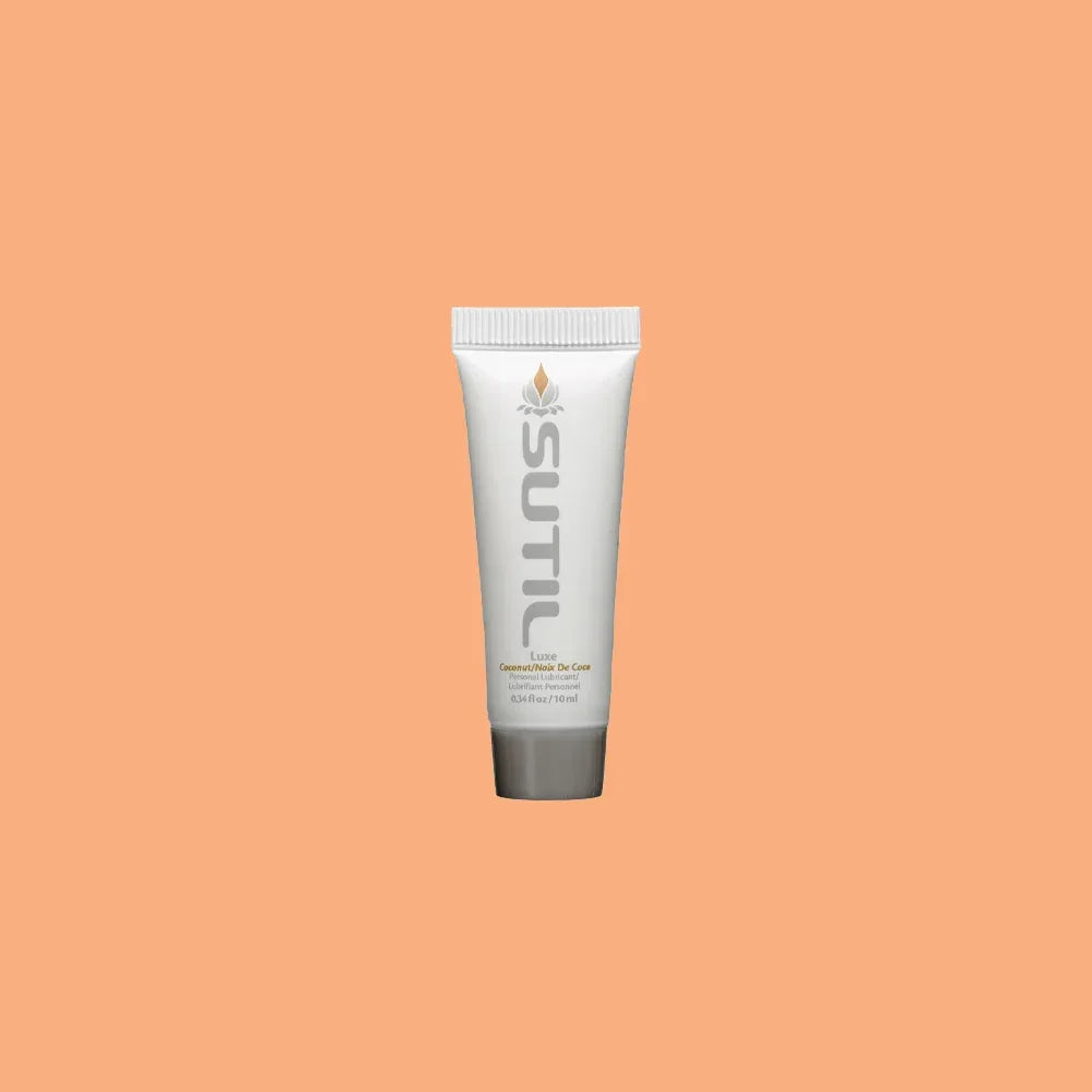Mini Sutil Coconut Flavored Lube displayed over an orange background