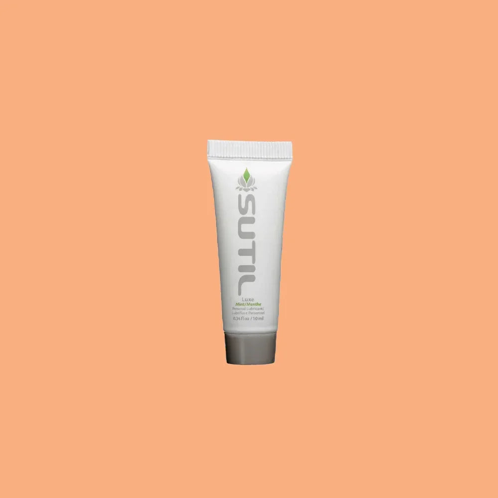 Mini Sutil Mint Flavored Lube displayed over an orange background