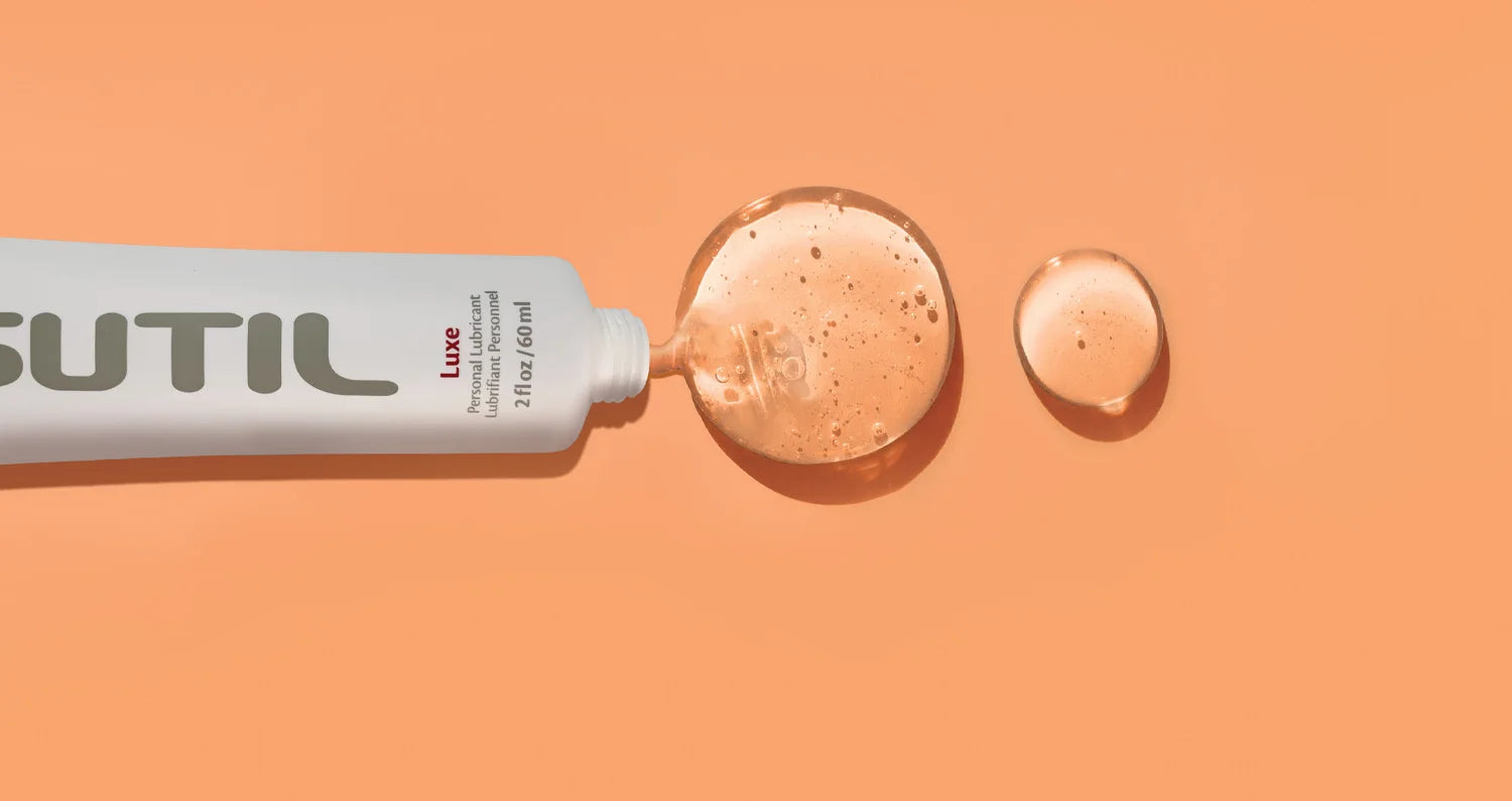Sutil Luxe lube on an orange background